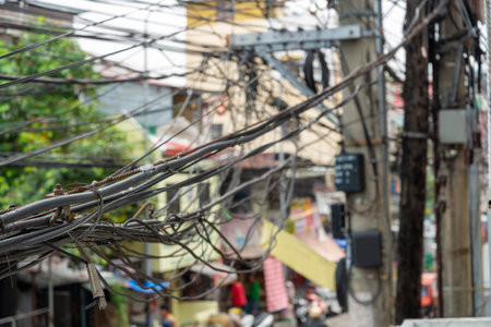 Looking from above,at a first floor location and street corner junction.Many complex,jumbled wire...
