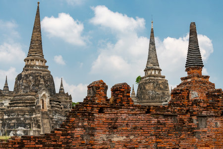 The distinctive and famous pagodas of Wat Phra Si Sanphet,at sunset,in the beautiful grounds of the iconic ancient Royal Palace,of the former capital of Siam.の写真素材