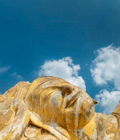 Laying in repose in the afternoon sun,the huge,8 metres high stone statue of Buddha is a popular...