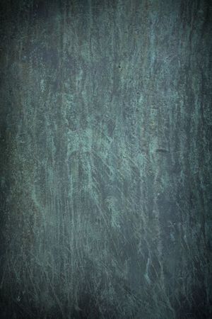 Dark blue scratch marks on rusty metal backgroundの写真素材