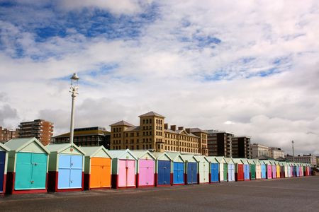Long row of beach huts on Brighton seafront, Brighton, England, UKの写真素材