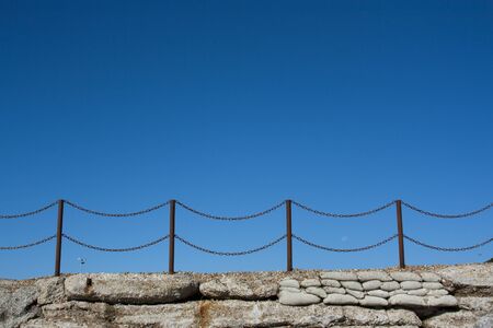 Rusty chain fence on Hastings beach, Englandの写真素材