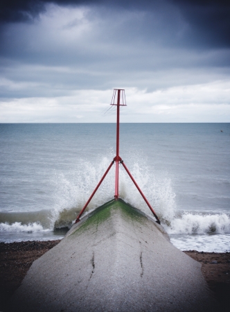 Water breaking on the shore, Brightonの写真素材