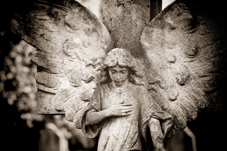 Angel with hand on heartの写真素材