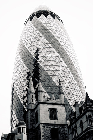 LONDON - SEPTEMBER 21  The modern glass buildings of the 30 St Mary Axe, Swiss Re, Gherkin September 21, 2013, during the annual Open House event in London, UK  This tower is 180 meters tall のeditorial素材