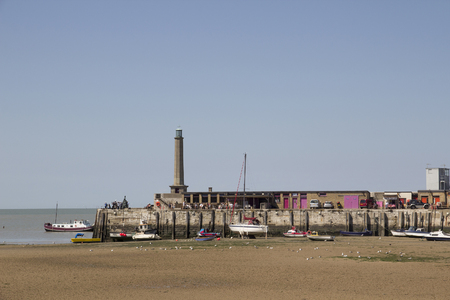 MARGATE, KENT, UK - AUGUST 8. 2015. The 1812 Margate Stone Pier with lighthouse in the historic English town of Margate, Kent, UK.のeditorial素材