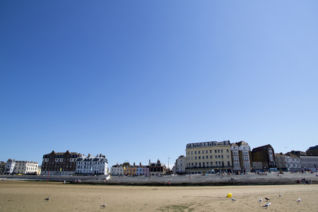 MARGATE, KENT, UK - AUGUST 8. 2015. English seaside town with old fashioned painted houses and shops located in the historic town of Margate, Kent, UK.のeditorial素材