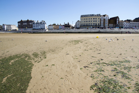 MARGATE, KENT, UK - AUGUST 8. 2015. English seaside town with old fashioned painted houses and shops located in the historic town of Margate, Kent, UK.のeditorial素材