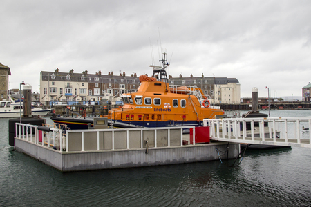WEYMOUTH, DORSET, UK - DECEMBER 26. 2017. Lifeboat moored at Weymouth old harbour, a coastal town in the county of Dorset in England, UK.のeditorial素材