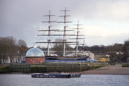 LONDON, UK - MAY 20, 2017. The Cutty Sark at Greenwich. Built in 1869, was the fastest trading ship of her time. The Dome is the entrance to the public footpath running under the Thames, Greenwich, London, England, UK, May 20, 2017.のeditorial素材