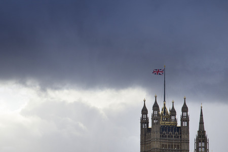 LONDON, ENGLAND - FEBRUARY 12, 2018. View of Big Ben and the Houses of Parliament with dark skies,...
