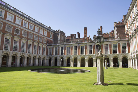 LONDON, UK - May 11, 2018. Courtyard at Hampton Court Palace which was originally built for Cardinal Thomas Wolsey 1515, later became King Henry VIII residence. London, Uk - May 11, 2018のeditorial素材