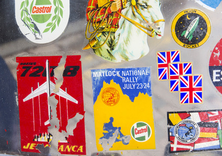 LONDON, ENGLAND - April 28, 2018. Badges and stickers on Lambretta windshield at the annual Classic...