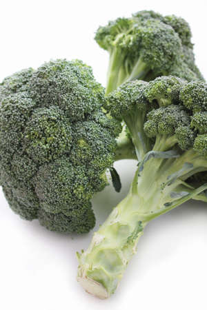 fresh broccoli isolated on whiteの写真素材