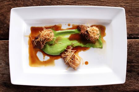 pan fpan fried scallops plated appetizer starterの写真素材