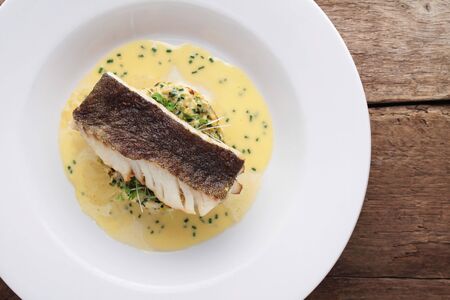 plated cod fish dinnerの写真素材