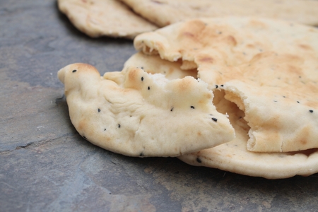 Indian naan bread and poppadumの写真素材