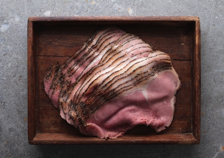 fresh sliced beef pastrami in wooden trayの写真素材