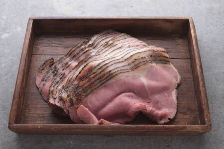 fresh sliced beef pastrami in wooden trayの写真素材