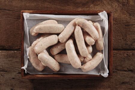 uncooked linked British sausagesの写真素材