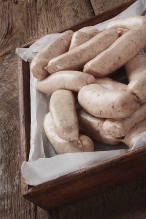 uncooked linked British sausagesの写真素材
