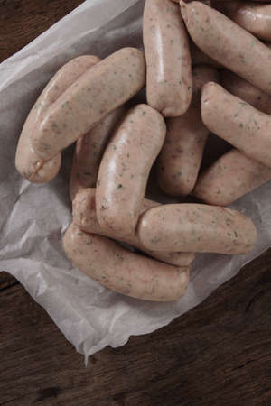 uncooked linked British sausagesの写真素材