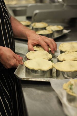 baker making piesの写真素材