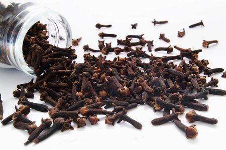 fresh cloves spices isolated on whiteの写真素材