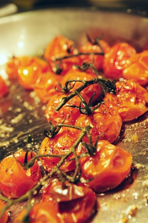 chef cooking and preparing plated mealの写真素材