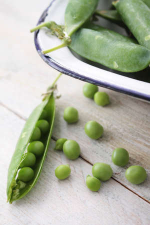 fresh garden peas in podの写真素材