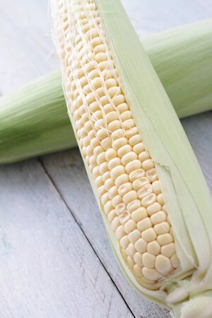 fresh sweetcorn cobの写真素材