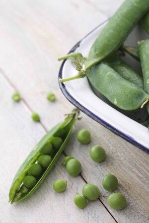 fresh garden peas in podの写真素材