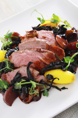 plated roast duck breast saladの写真素材