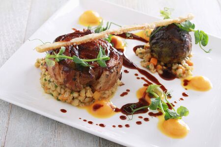 plated gourmet pork mealの写真素材