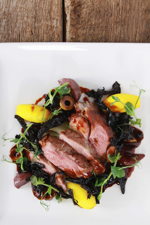 plated roast duck breast saladの写真素材