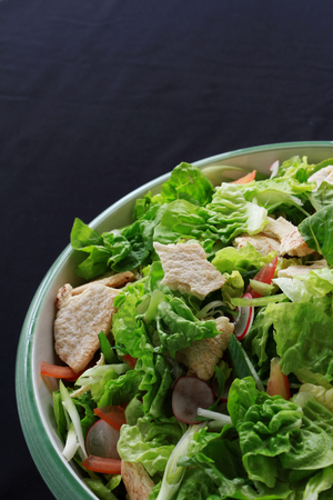 mixed green salad in bowlの写真素材