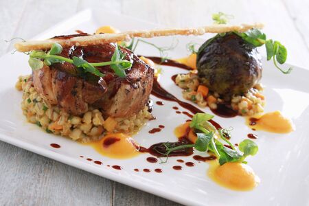 plated gourmet pork mealの写真素材
