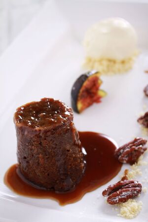 plated sticky toffee pudding dessertの写真素材