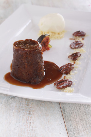 plated sticky toffee pudding dessertの写真素材