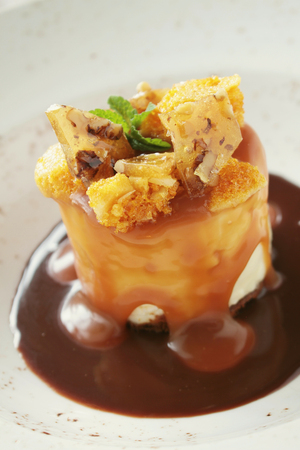 plated toffee cheesecake dessert with cinder toffeeの写真素材