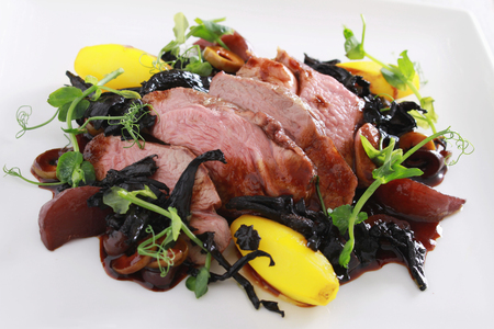 plated roast duck breast saladの写真素材
