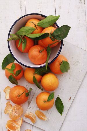 fresh orange clementines on wooden backgroundの写真素材
