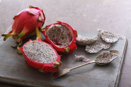 fresh sliced dragonfruit on chopping boardの写真素材