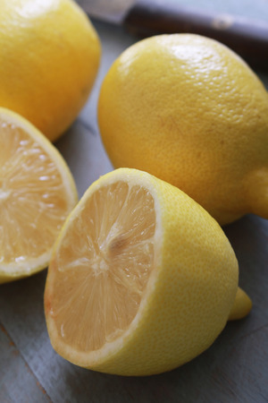 fresh sliced lemons on chopping boardの写真素材