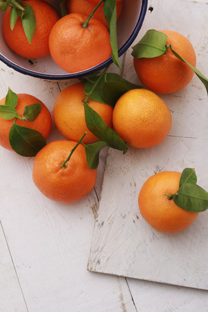 fresh orange clementines on wooden backgroundの写真素材