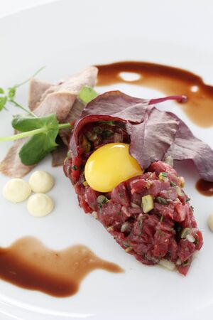 plated traditional beef steak tartare appetizer mealの写真素材