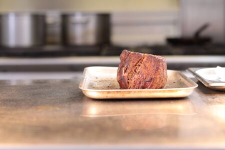 cooked beef fillet steak resting on trayの写真素材