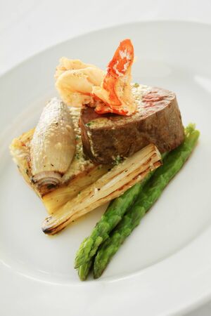 gourmet fillet steak surf and turf plated mealの写真素材