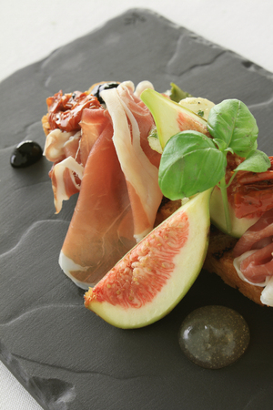 fig and cured ham bruschetta  appetizer starterの写真素材