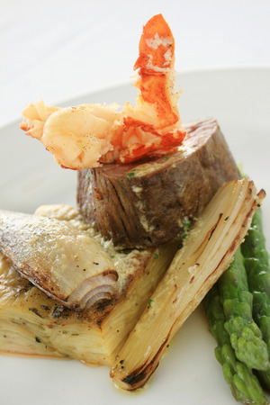 gourmet fillet steak surf and turf plated mealの写真素材
